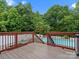 Wooden patio deck overlooks the swimming pool and lush greenery at 3038 Sterling Ct, Fort Mill, SC 29707