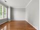 Bright, empty room with hardwood floors, white trim, neutral paint, and plenty of natural light at 3038 Sterling Ct, Fort Mill, SC 29707