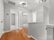 Upstairs hallway featuring hardwood flooring, neutral paint, and access to multiple rooms at 3038 Sterling Ct, Fort Mill, SC 29707
