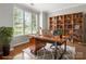 Cozy home office with built-in bookshelves, hardwood floors, and ample natural light at 3038 Sterling Ct, Fort Mill, SC 29707