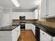 Bright kitchen with stainless-steel appliances, light cabinets, and hardwood flooring at 3038 Sterling Ct, Fort Mill, SC 29707