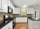 Bright kitchen with stainless-steel appliances, light cabinets, and hardwood flooring at 3038 Sterling Ct, Fort Mill, SC 29707