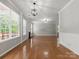 Spacious living room with a fireplace and large windows for lots of natural light at 3038 Sterling Ct, Fort Mill, SC 29707