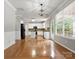 Open concept living room connected to kitchen, featuring a fireplace, a deck, and lots of natural light at 3038 Sterling Ct, Fort Mill, SC 29707