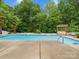 Refreshing in-ground pool provides ample space for swimming and recreation amidst a private backyard oasis at 3038 Sterling Ct, Fort Mill, SC 29707