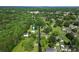 An aerial view of a white home with mature trees and a blue arrow pointing towards the property at 320 E Pine St, Maiden, NC 28650