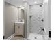 Beautiful bathroom featuring tiled walk-in shower, vanity, and modern fixtures at 320 E Pine St, Maiden, NC 28650