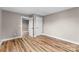 Bedroom interior with new hardwood floors and neutral paint, with white trim at 320 E Pine St, Maiden, NC 28650