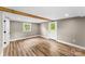 Charming bedroom with hardwood-style floors, exposed beam, and white door at 320 E Pine St, Maiden, NC 28650