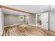 Spacious bedroom featuring wood-look flooring, exposed beam, and natural light at 320 E Pine St, Maiden, NC 28650