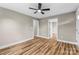 Bedroom showcasing new hardwood floors, neutral paint and a ceiling fan at 320 E Pine St, Maiden, NC 28650