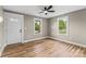 Cozy bedroom highlighting the windows that brighten the room, flooring and neutral paint at 320 E Pine St, Maiden, NC 28650