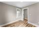 Cozy bedroom with luxury vinyl plank flooring, neutral paint, and large closet at 320 E Pine St, Maiden, NC 28650