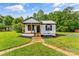 Cozy home with a well-maintained front yard and walkway to the front entrance at 320 E Pine St, Maiden, NC 28650
