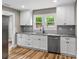 Beautiful kitchen featuring stainless steel appliances, gray subway tile backsplash, and granite countertops at 320 E Pine St, Maiden, NC 28650