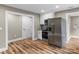 Bright kitchen with stainless steel refrigerator, recessed lighting, and updated luxury vinyl plank flooring at 320 E Pine St, Maiden, NC 28650