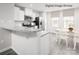 Bright eat-in kitchen featuring white cabinets, stainless steel appliances, and a cozy dining area at 3233 Dannelly Towns Aly # 1002C, Charlotte, NC 28208