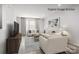 Bright living room with stylish sofas, modern decor, and an inviting atmosphere for relaxation at 3233 Dannelly Towns Aly # 1002C, Charlotte, NC 28208