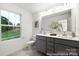 Bright bathroom featuring a double vanity, a large window with natural light, and modern fixtures at 32562-B Millingport Rd # 7155, New London, NC 28127