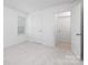 A bedroom with carpeted floor, a window letting in natural light and two doors at 32562-B Millingport Rd # 7155, New London, NC 28127