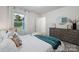 Bright bedroom features a large window, plush bedding, and stylish decor, creating a serene retreat at 32562-B Millingport Rd # 7155, New London, NC 28127