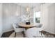 Cozy dining area with natural light, featuring a modern table with four chairs, rug, and pendant lighting at 32562-B Millingport Rd # 7155, New London, NC 28127
