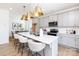 Modern kitchen with white countertops, gray cabinets, stainless steel appliances, and pendant lighting at 32562-B Millingport Rd # 7155, New London, NC 28127