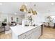 Modern kitchen island with white countertops, gray cabinets, and stainless steel appliances at 32562-B Millingport Rd # 7155, New London, NC 28127