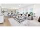 Bright open-concept living room featuring a modern kitchen, stylish furniture, and large windows for ample natural light at 32562-B Millingport Rd # 7155, New London, NC 28127