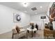 Bright living room features neutral walls and decor with cozy seating arrangement and ample natural light at 32562-B Millingport Rd # 7155, New London, NC 28127