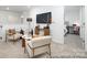 Open living area showcases modern furnishings, a mounted TV, and a view into the adjacent bedroom at 32562-B Millingport Rd # 7155, New London, NC 28127