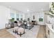 Bright living room featuring modern furnishings, neutral colors, and large windows with natural light at 32562-B Millingport Rd # 7155, New London, NC 28127
