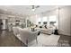 Bright living room with modern furniture, neutral tones, and open kitchen with bar seating at 32562-B Millingport Rd # 7155, New London, NC 28127