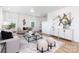 Bright living room featuring modern furnishings, neutral colors, and large windows with natural light at 32562-B Millingport Rd # 7155, New London, NC 28127