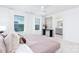 Spacious main bedroom featuring a comfortable bed, large windows, and a view of the ensuite bathroom at 32562-B Millingport Rd # 7155, New London, NC 28127