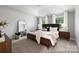 Tranquil main bedroom boasts abundant natural light, neutral tones, and stylish contemporary furnishings at 32562-B Millingport Rd # 7155, New London, NC 28127