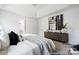 Spacious main bedroom is elegantly furnished with a tray ceiling, soft lighting, and sophisticated decor at 32562-B Millingport Rd # 7155, New London, NC 28127