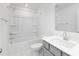 Bathroom with gray vanity, white sink, chrome faucet, toilet, and shower-tub combination at 32616 Millingport Rd # 7144, New London, NC 28127