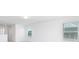 This bedroom is spacious with neutral carpet, white walls, and several windows to the outside at 32616 Millingport Rd # 7144, New London, NC 28127