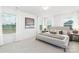 A bright bedroom with carpet, large windows, and simple decor at 32616 Millingport Rd # 7144, New London, NC 28127