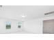 The bedroom has neutral carpet, white walls, and several windows to the outside at 32616 Millingport Rd # 7144, New London, NC 28127