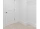 The walk-in closet has neutral carpet, white walls, and a shelf for storage at 32616 Millingport Rd # 7144, New London, NC 28127