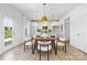 Bright eat-in kitchen features white cabinets, stainless steel appliances, and pendant lighting at 32616 Millingport Rd # 7144, New London, NC 28127