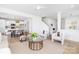 Bright, open-concept living room with modern decor and hardwood floors at 32616 Millingport Rd # 7144, New London, NC 28127