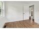 Bright bedroom with hardwood floors, neutral paint, and a window for natural light at 330 Willow Oak Cir, Lancaster, SC 29720