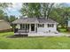 Charming, single-story home with a freshly painted white brick exterior and black trim at 330 Willow Oak Cir, Lancaster, SC 29720