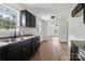 Bright kitchen featuring dark cabinets, new countertops, and modern fixtures at 330 Willow Oak Cir, Lancaster, SC 29720