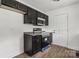Modern kitchen featuring dark cabinets, stainless-steel appliances, and a new microwave at 330 Willow Oak Cir, Lancaster, SC 29720