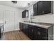 Modern kitchen with dark cabinets, new countertops, and stainless-steel appliances at 330 Willow Oak Cir, Lancaster, SC 29720