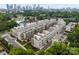 A sprawling aerial view showing the townhome community with its modern architecture and manicured landscaping at 336 Uptown West Dr, Charlotte, NC 28208
